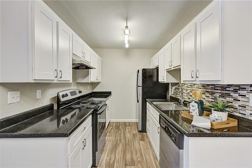 Newly renovated kitchens feature a tile back-splash, granite