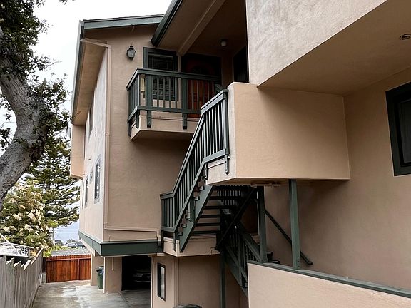 Stairs that lead to the unit.
Driveway to the carport area under units.