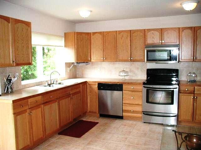 Open kitchen with tile floors