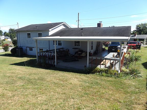 Rear with covered deck.