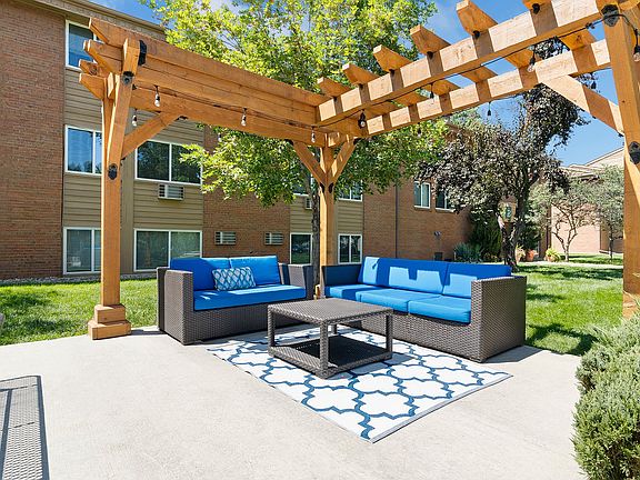 Enjoy the fresh air in style_your outdoor living room awaits with plush seating and serene vibes.