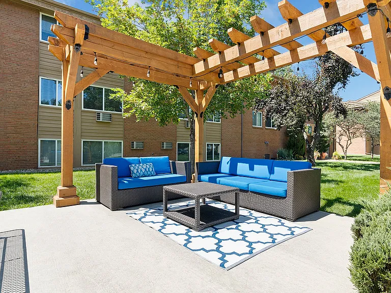 Enjoy the fresh air in style_your outdoor living room awaits with plush seating and serene vibes.