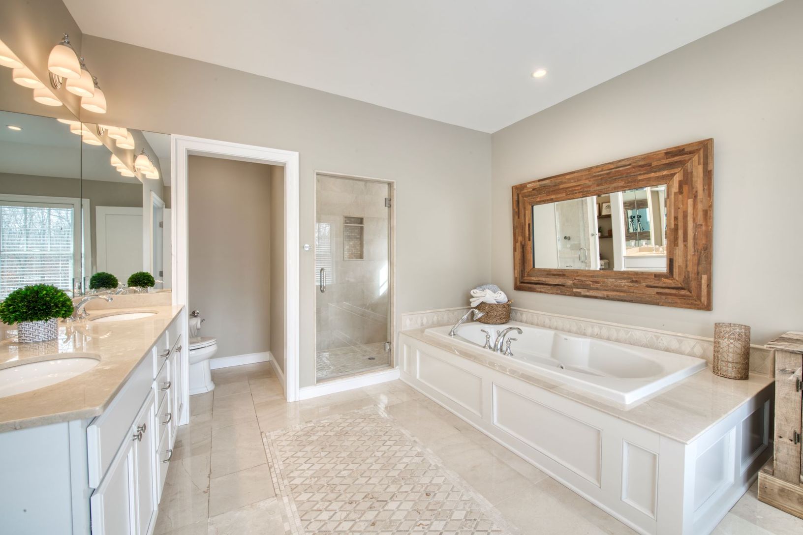  primary bathroom with jacuzzi, shower, two vanities
