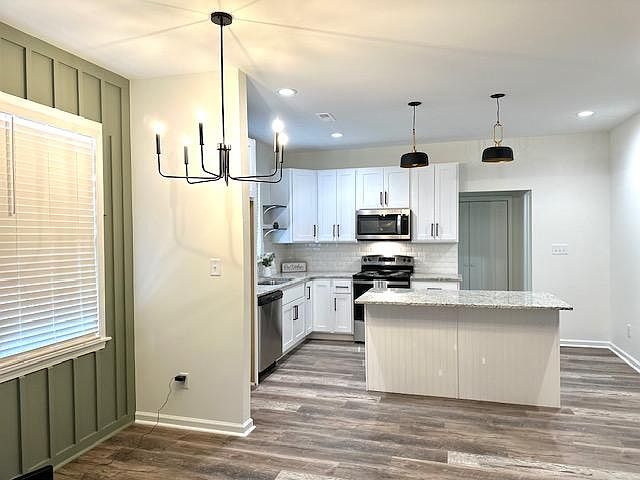Large open space. Living and dining area. Kitchen island is a must see!