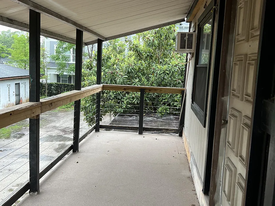 Porch and front door. 
Come into unit from the back yard