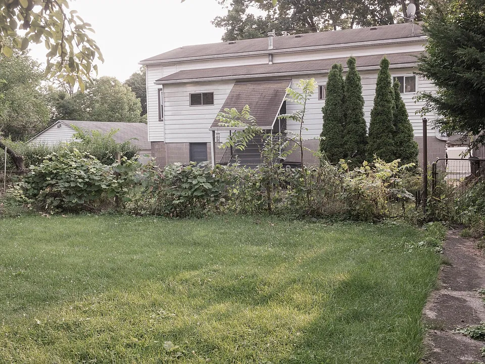 View of backyard from the first floor exit of property