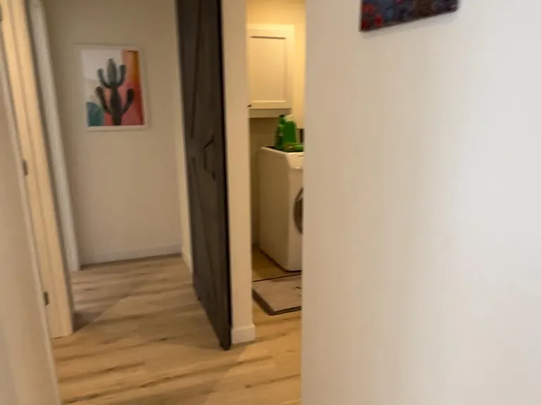Hallway 1: To left, half bath. To the right to the laundry room and garage. Further down to the left, to the master suite.
