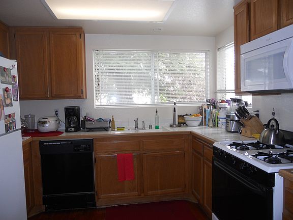 Kitchen has a ton of cabinets and counter space