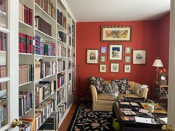 Front Den/Library with custom made french doors and floor to ceiling bookshelves