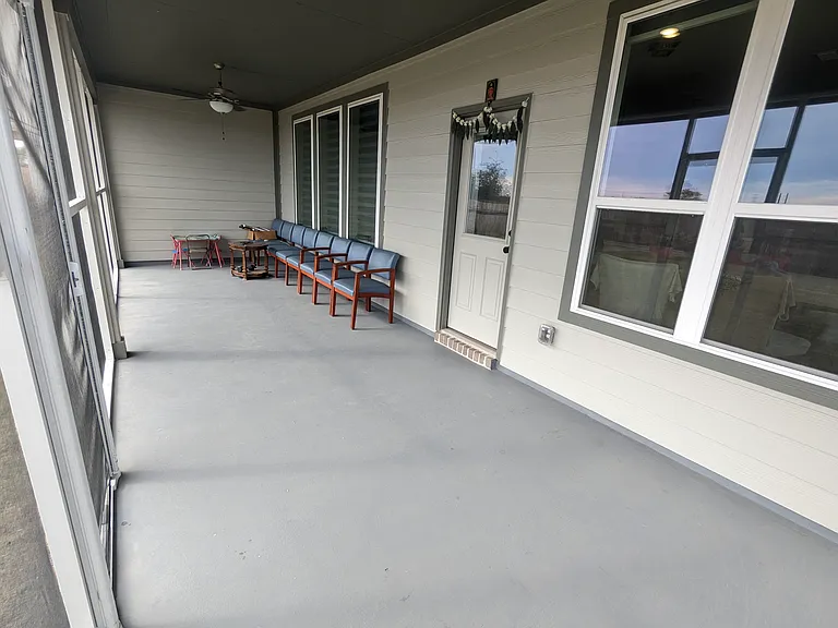 Covered & Screened back patio with painted floor