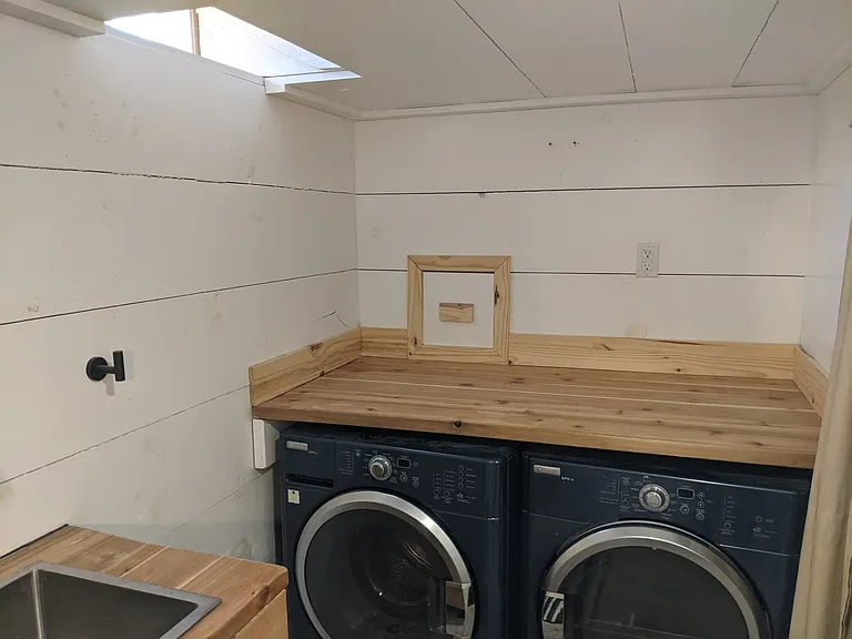 Laundry is located in the basement bathroom.