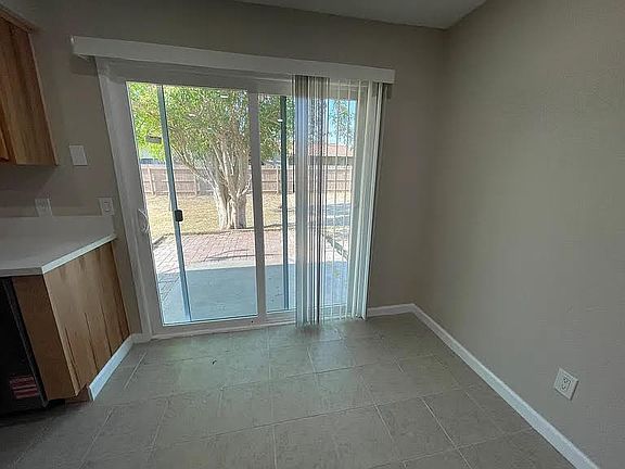 DINING ROOM EXIT TO PRIVATE BACK YARD