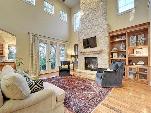 The stacked stone fireplace is an incredible focal point of this living area.