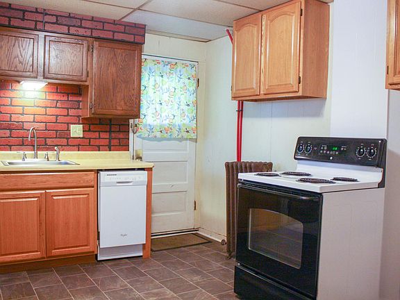 Kitchen with view of entrance.