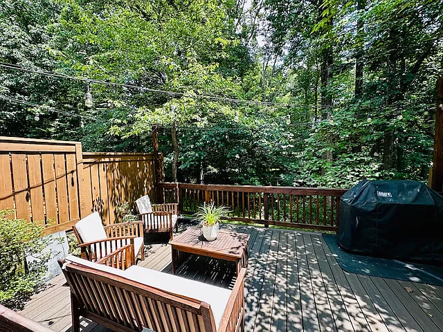 Enjoy your remodeled private deck, offering breathtaking views of the surrounding forest and direct access to nearby walking trails. This serene outdoor space is perfect for relaxing, entertaining, or connecting with nature just steps from your door.