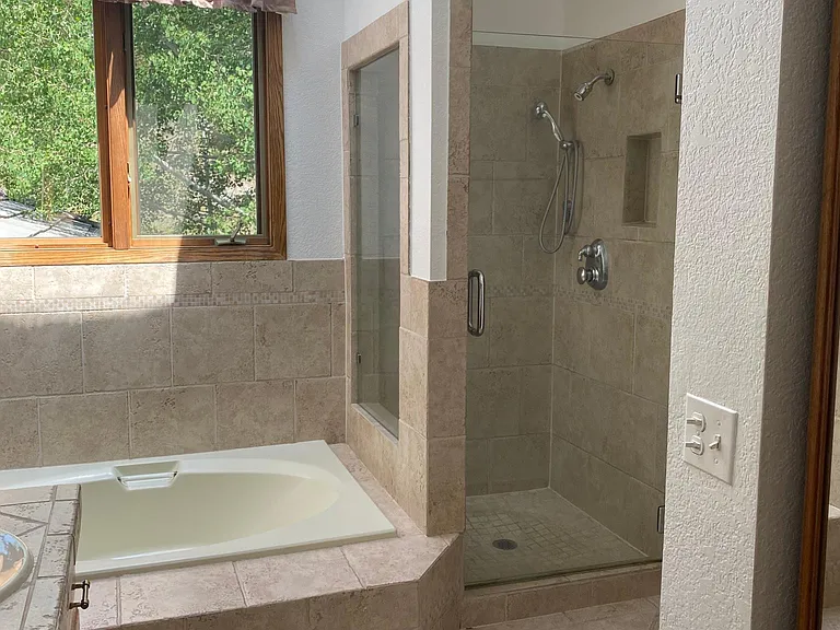En Suite Bath with garden tub, shower, two sinks, walk in closet, toilet room