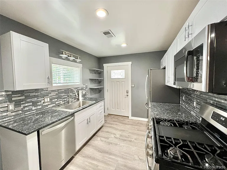4801 S Fox St — Photo 4