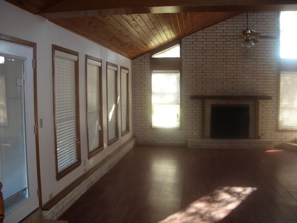 vaulted ceilings; and lots of windows make this living area a beautiful place to enjoy family