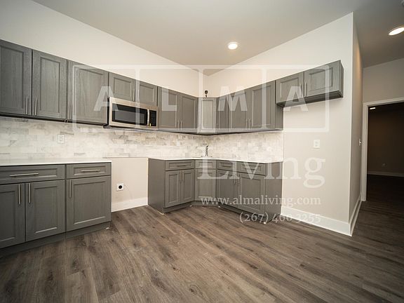 Kitchen includes a stove and fridge