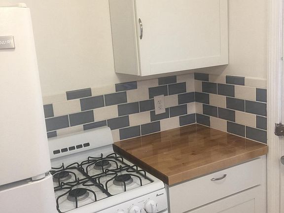 New cabinets, countertop, flooring, backsplash and appliance