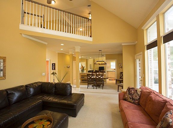 Upstairs loft overlooks Den.  So bright and cheerful throughout house.