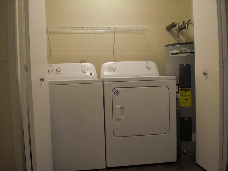 Washer and dryer are located upstairs in the hallway closet