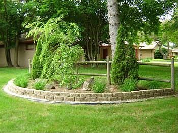 This landscaped focal point in the front yard is indication of professional landscaping of the whole yard.