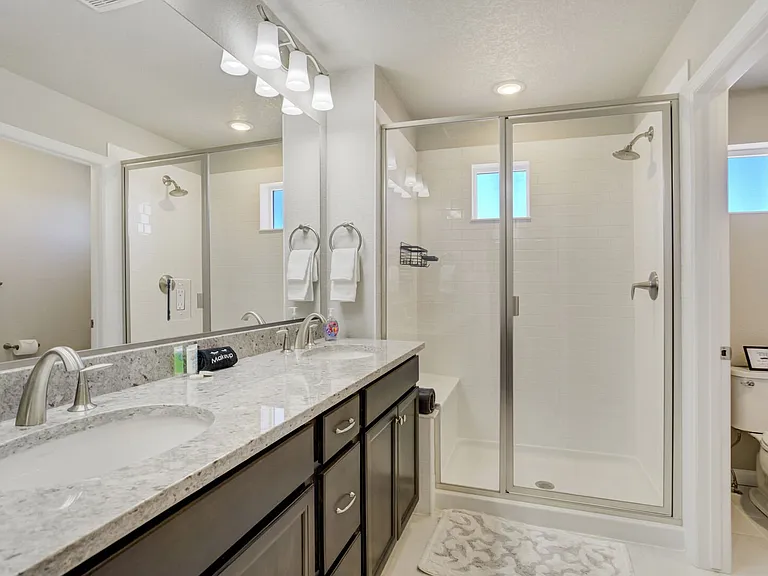 Master En-Suite
Attached bath with dual vanities, walk-in shower and walk-in closet.