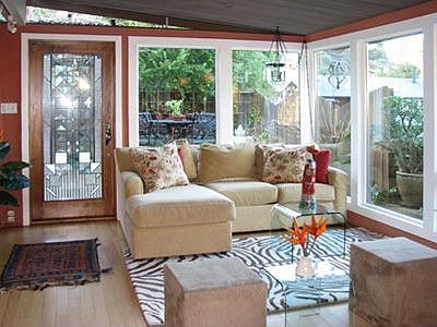 Bright, open living room with fireplace.