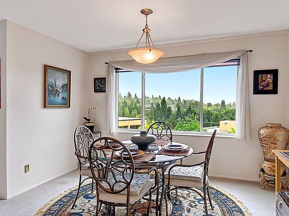 Open floor plan flows from living to dining room.