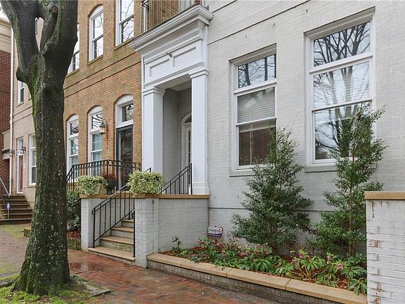 Covered entrance with flower bed