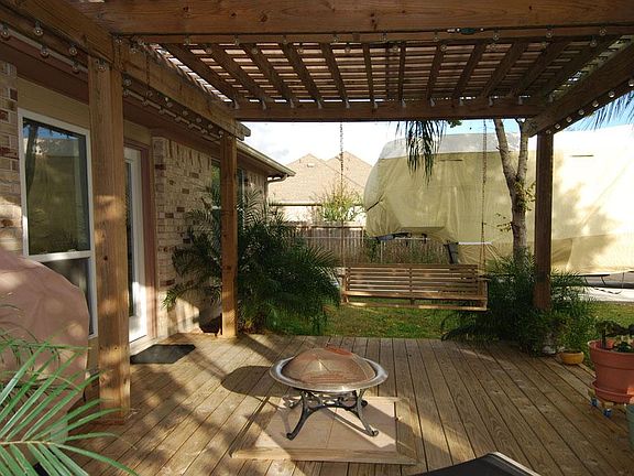 Perfect outdoor sitting area under the patio located off the sun room.
