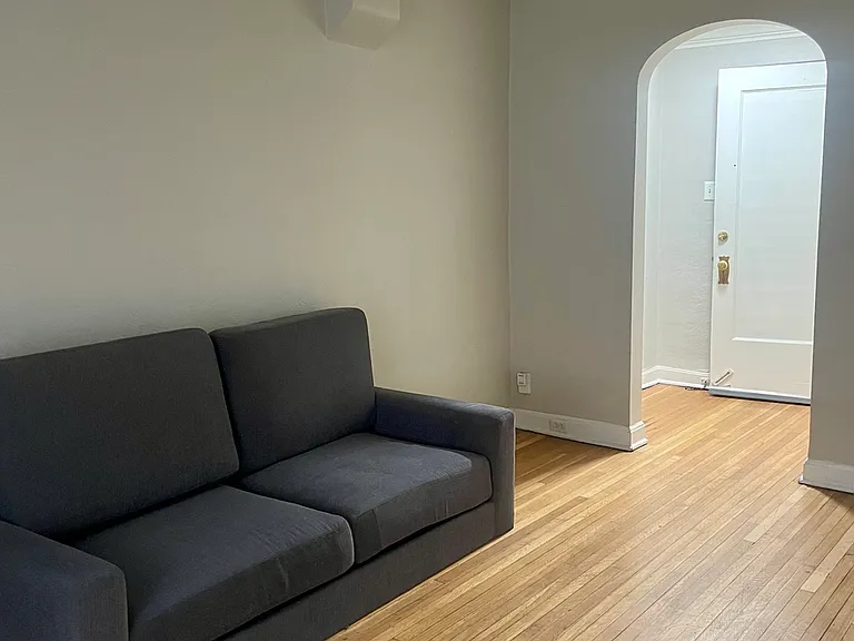 Large Living Room with Archway Entrance & Hardwood Floors Large Living Room with Archway Entrance & Hardwood Floors