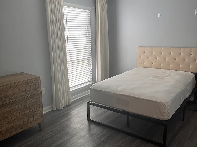 Master bedroom with queen bed, dresser and night stand. Also has walk in closet