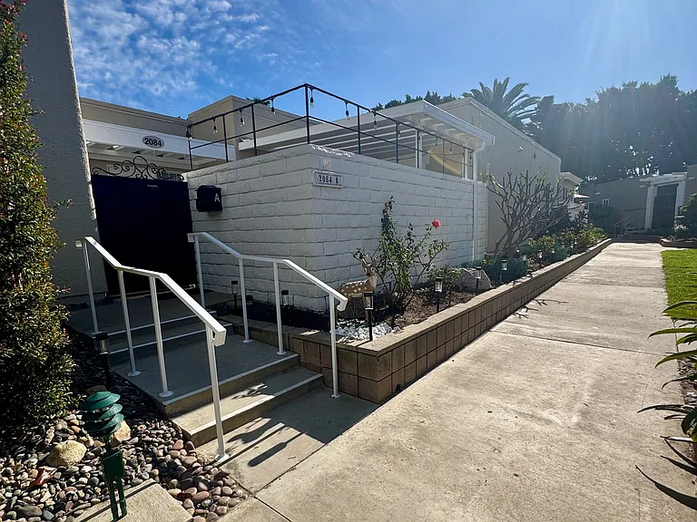 Private Entrance, with grassy areas surrounding building to take your dog out