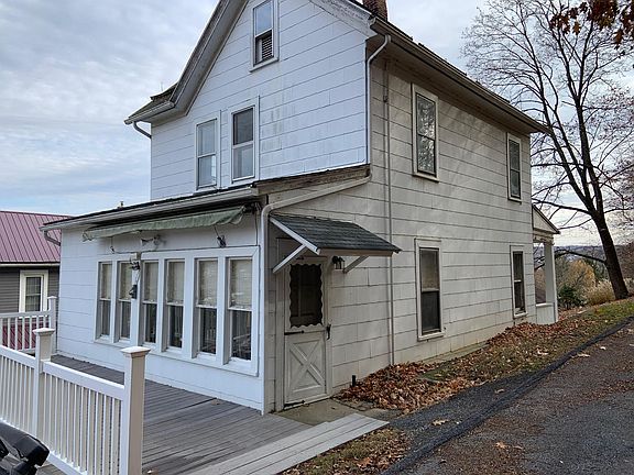 Rear entrance with new deck & railing and Sunsetter awning