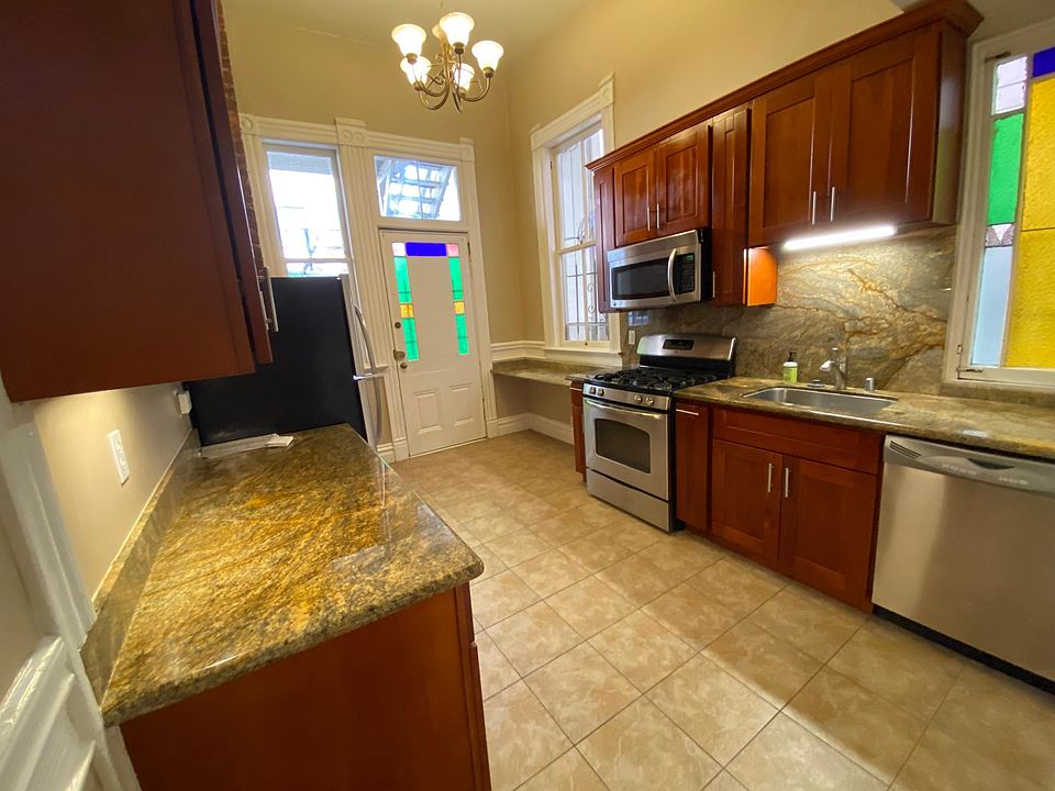 Large Kitchen with lots of natural light, plenty of cabinets and counters. All stainless steel appliances including dishwasher