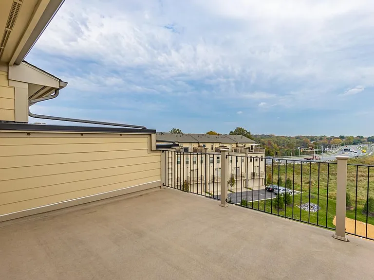 Rooftop terrace 20' X 12' with an open view of a green area.