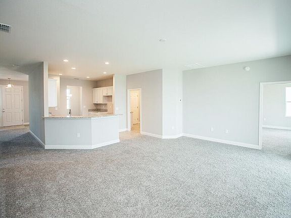 Open kitchen and gathering room - New home for sale in Auburndale, FL