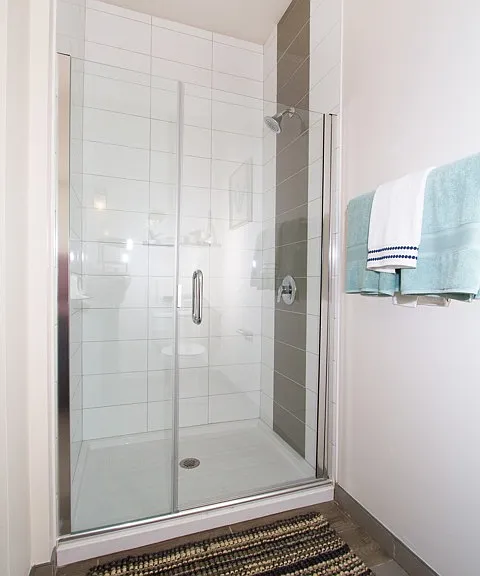 Serene bathrooms with spa-like soaking tubs or glass showers