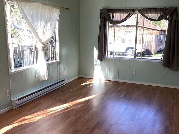 Living Room - Full sun all day (windows south/west facing), sliding glass door for cross breeze