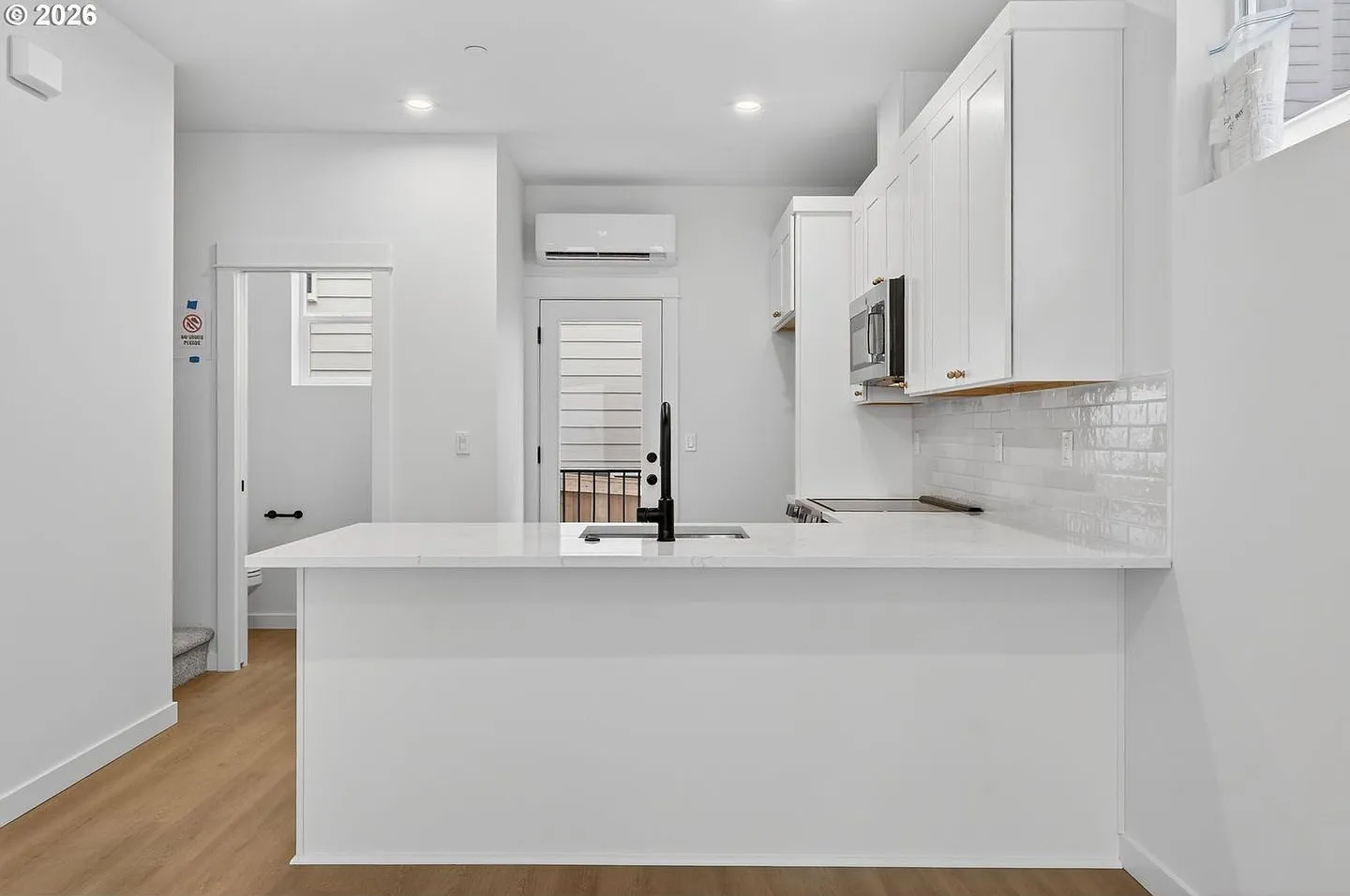 Brand-New 2-Bedroom Home with White Granite Kitchen, Open-Concept Living & Attached Garage — Photo 2