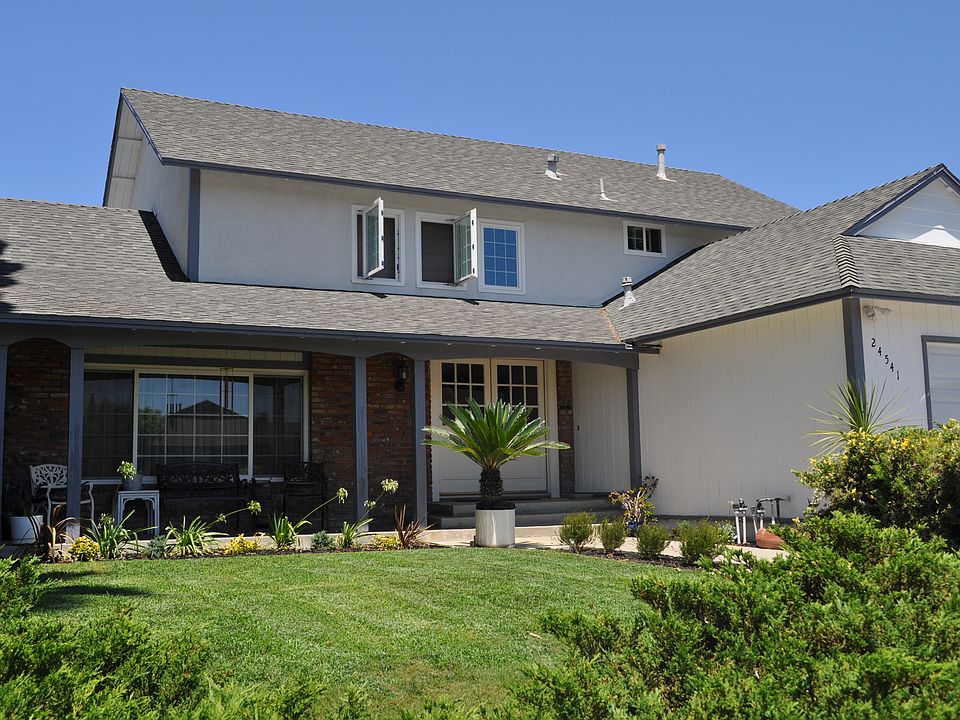 Covered porch and grass area