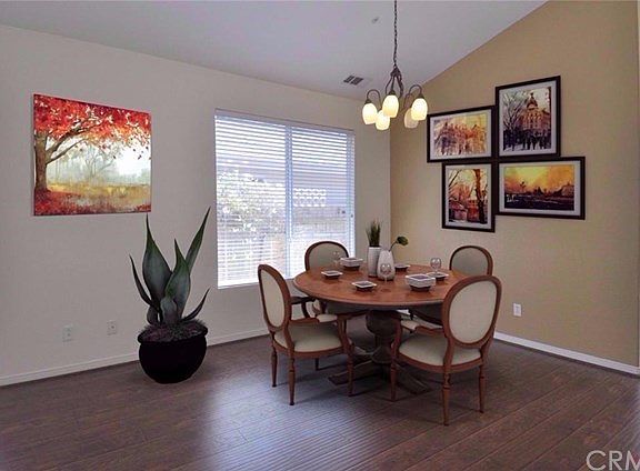 This photo shows the dining area virtually staged.