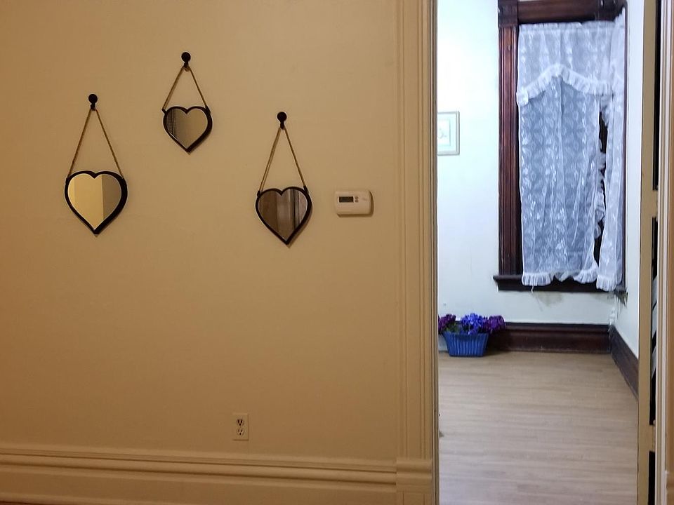 Hallway to 2 beds and kitchen