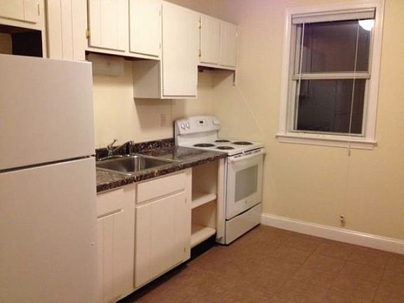 Kitchen - similar but dark wood cabinets