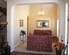 Currently used as an additional living area, the large formal dining room 