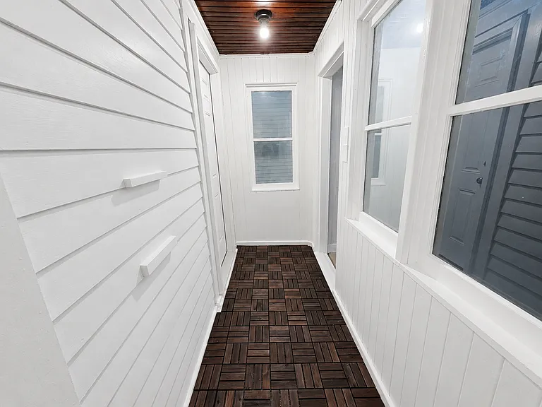Enclosed porch/entry area with updated flooring