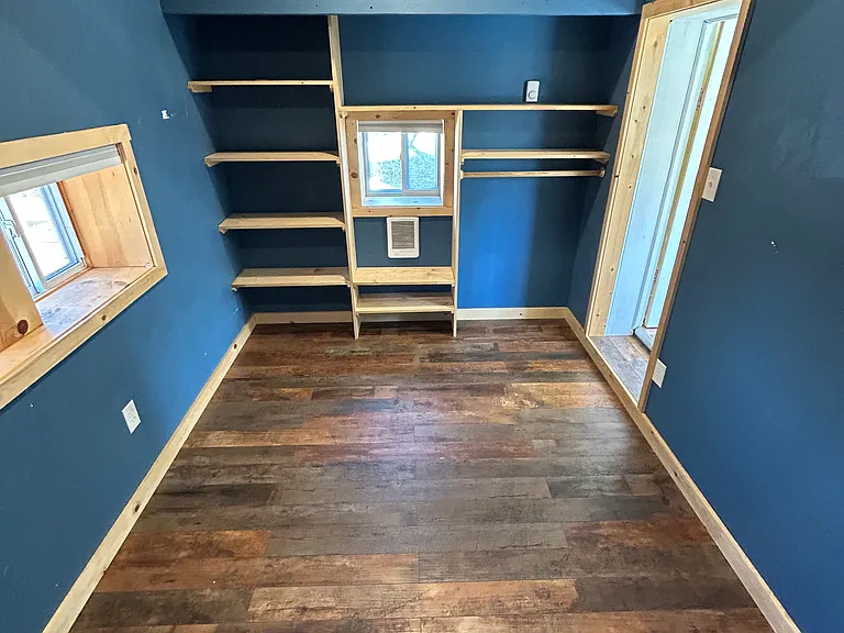 Behold: bonus "bedroom" _ not technically a bedroom (thanks, window rules), but still a dreamy space with vaulted ceilings and built-ins galore. Perfect for an office, creative nook, or that secret lair you've always wanted. Cozy with a side of character!