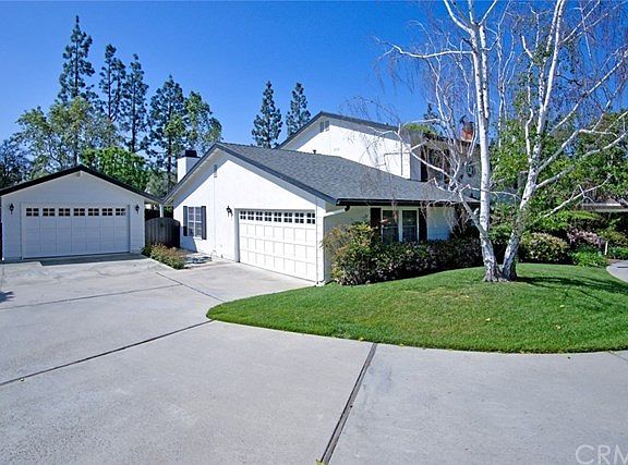 Beyond the humble looking detached garage is a HUGE tandem garage that can hold tons of toys and pos